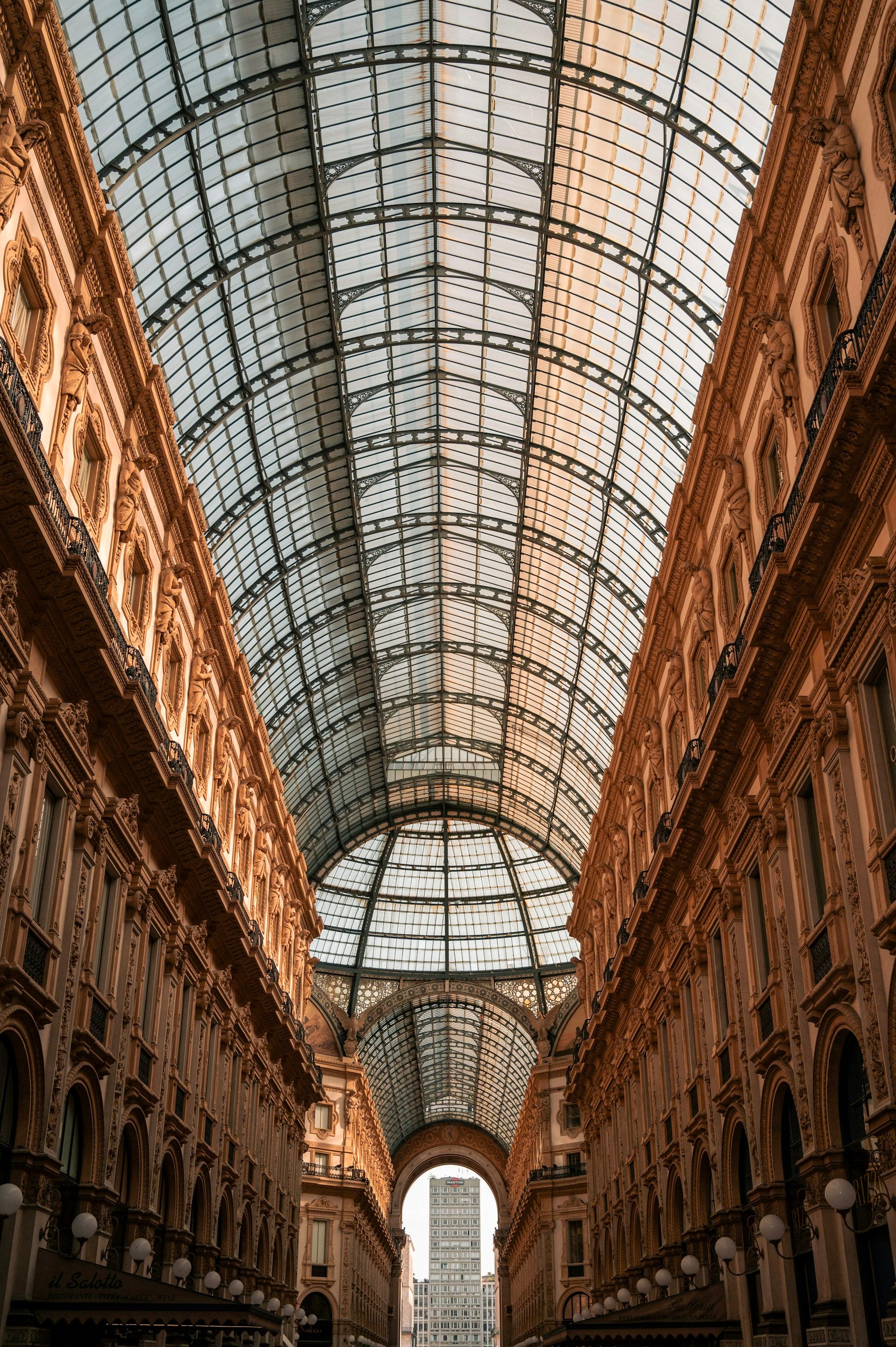 The glass canopy and historic arcades of Galleria Vittorio Emanuele II, Milan